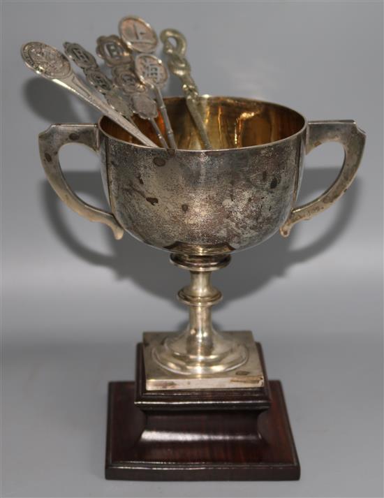 A Chinese silver two handled cup by Tuck Chang and five spoons.